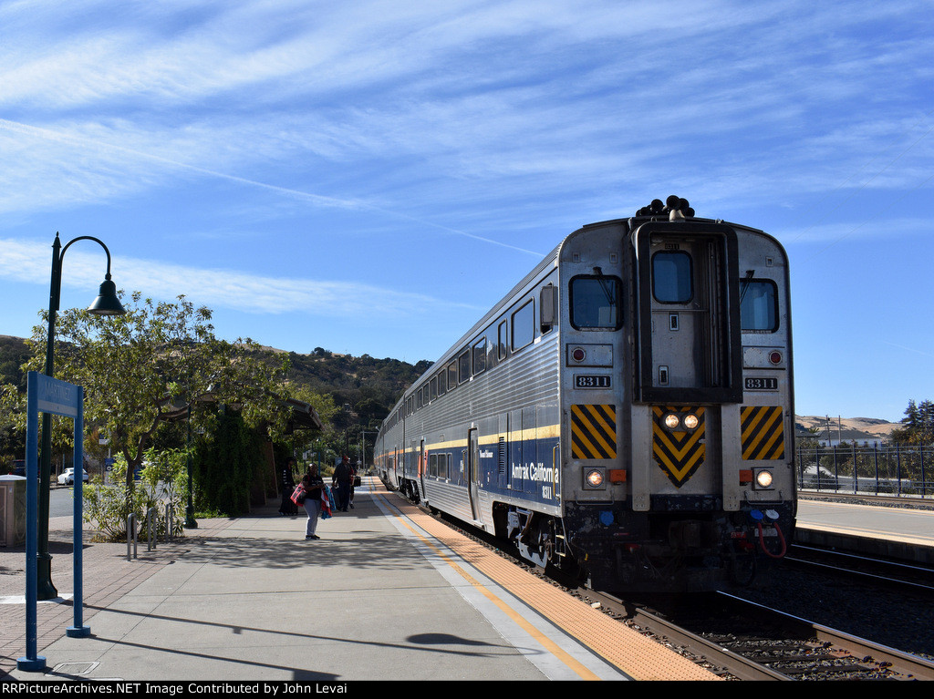 Amtrak San Joaquin Train # 716 about to make its stop with California Bilevel Car # 8311 as the leader